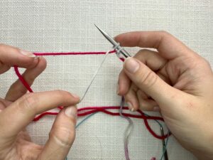 Provisional Cast On Without Crochet Hook: Hold the new loop you’ve just made on your needle with a finger on your right hand so it doesn't slip off your needle.