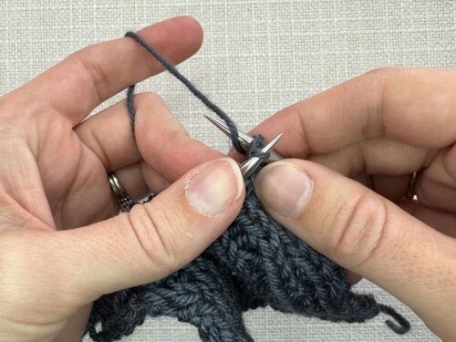 Kb1 in Knitting Step 2. With your working yarn in the back, wrap the yarn around your needle from bottom to top/front to back (exactly the same way you wrap for every knit stitch).