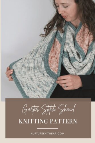 One Cloudy Night shawl worn around the neck, with peach and pale speckled garter stitch sections framed in teal. Text reads “Garter Stitch Shawl Knitting Pattern.”
