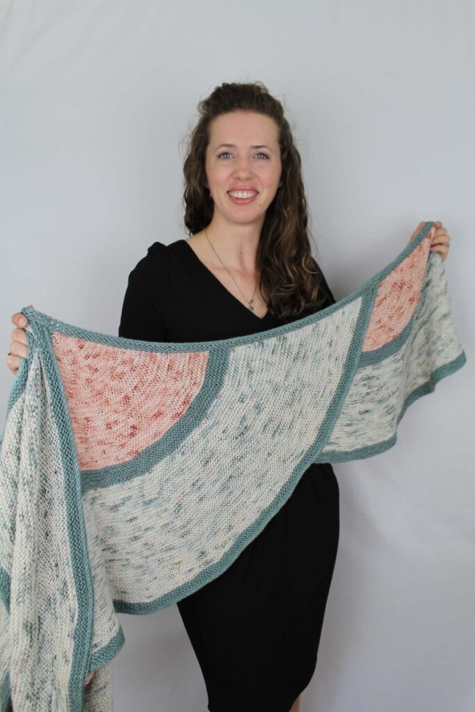 One Cloudy Night shawl held open to show three curved Cloudlets and the generous wingspan.